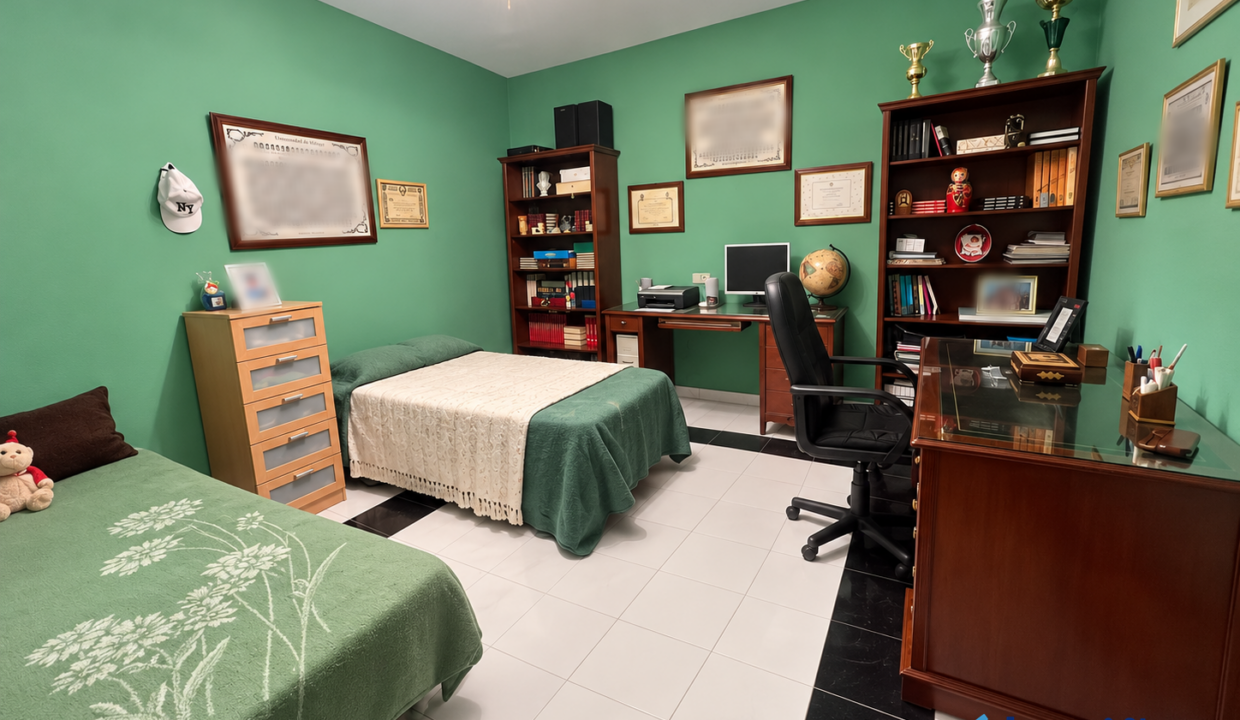 Dormitorio-estudio verde con diplomas y trofeos